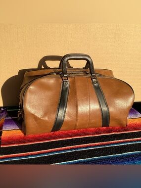 Vintage leather travel duffel bag with talon zippers